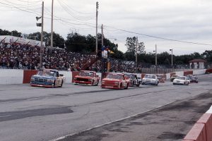 LOUISVILLE, KY - JUNE 3, 1995:  Butch Miller (No. 98) leads Ron Hornaday, Jr. (No. 16), Joe Ruttman (No. 84) and Mike Skinner (No. 3) during the Ford Credit 200 NASCAR SuperTruck Series race at Louisville Motor Speedway. Skinner went on to win the race. (Photo by ISC Images & Archives via Getty Images)