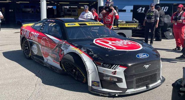 Visit Harvick wrecks early at Kansas page