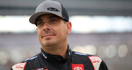 Stewart Friesen looks on.