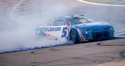 Kyle Larson performs a burnout after winning at Kansas.