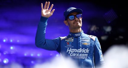Kyle Larson waves before a NASCAR Cup Series race.