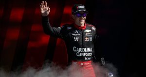 Connor Zilisch waves to the crowd during driver introductions at Kansas Speedway.