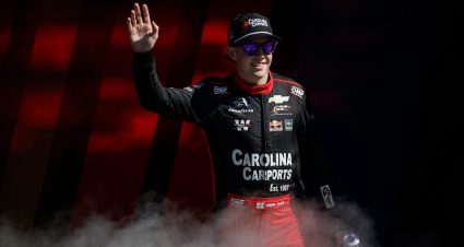Connor Zilisch waves to the crowd during driver introductions at Kansas Speedway.