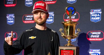 steven wilson poses with Coca cola iracing series trophy