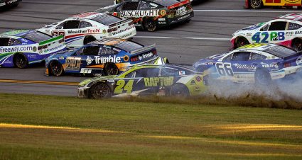 Kyle Larson, right, talks to crew chief Cliff Daniels on pit road at Talladega Superspeedway