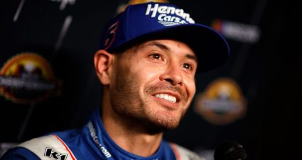 Kyle Larson smiles during a press conference