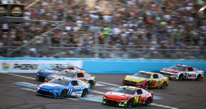 Denny Hamlin races William Byron, Kyle Larson and others on Nov. 2, 2025 in the NASCAR Cup Series Championship race at Phoenix Raceway.