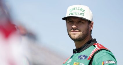 Todd Gilliland looks on.