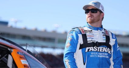 Chris Buescher looks on.