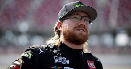 Tyler Reddick looks on.