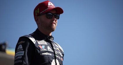 William Byron looks on.