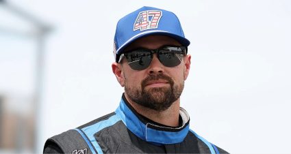 Ricky Stenhouse Jr. looks on.