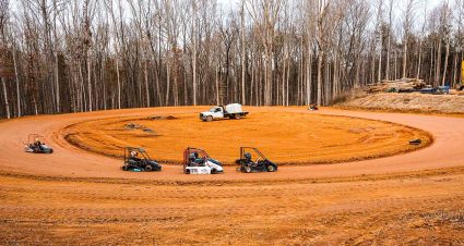 Niece Motorsports president and CEO Cody Efaw smiles as watches activity at the team's dirt track