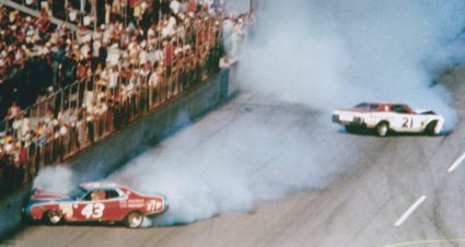 Track emergency workers try to break up a fight between Cale Yarborough, Donnie Allison and Bobby Allison after Yarborough and Donnie Allison crashed on the final lap while battling for the lead in the Daytona 500 at Daytona International Speedway.