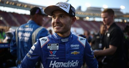 Cliff Daniels and Kyle Larson share a handshake in Victory Lane after winning the 2025 NASCAR Cup Series championship.