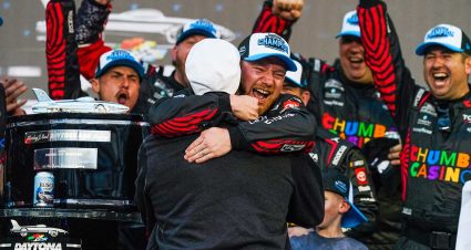 Tyler Reddick and his son Beau show off the latest addition to the Harley J. Earl Trophy