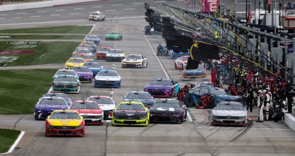 NASCAR Cup Series action on pit road at EchoPark Speedway.