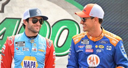 Chase Elliott laughs with Joey Logano