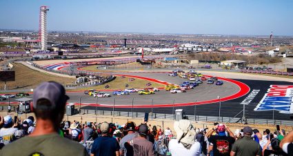 The No. 38 Ford of Zane Smith and No. 88 Chevy of Connor Zilisch spin in Turn 1 at the Circuit of The Americas