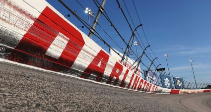 Cale Yarborough’s No. 10 Ford sits in the garage area of Darlington Raceway along with four other cars eliminated in early crashes in 1965 action