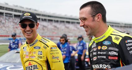 Joey Logano, driver of the #22 Pennzoil Ultra Platinum Ford, and Austin Cindric, driver of the #2 Menards/Duracell Ford, share a laugh on the grid during qualifying for the NASCAR Cup Series Coca-Cola 600 at Charlotte Motor Speedway on May 24, 2025 in Concord, North Carolina