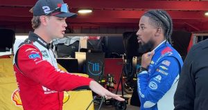 Jesse Love and Rajah Caruth speak after a NASCAR race at Martinsville.