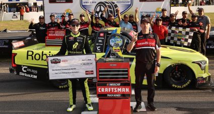 Corey Heim celebrates his Rockingham win with his Truck Series team.