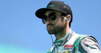 Chase Elliott looks on.