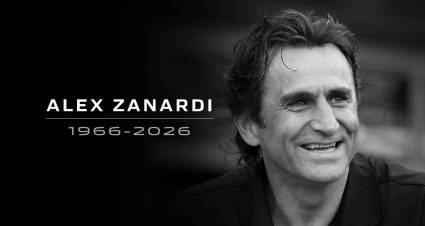 Former driver Alex Zanardi poses with team owner Chip Ganassi during a presentation of Zanardi's 1998 championship-winning Target Honda Reynard at Indianapolis Motor Speedway