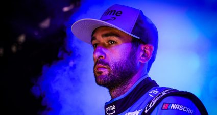 Chase Elliott looks on.