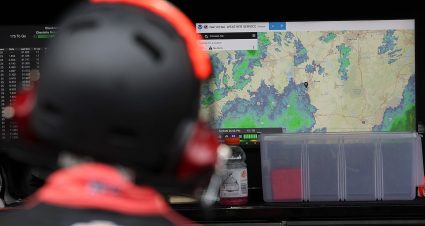 A crew member views a monitor displaying a weather map during the NASCAR O'Reilly Auto Parts Series race on May 24, 2026, at Charlotte Motor Speedway in Charlotte, North Carolina.