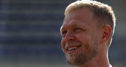 Kevin Magnussen looks on at a race.