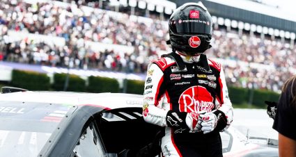 Christopher Bell stands next to his car after a NASCAR Cup Series race at Pocono.