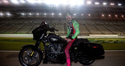 ryan blaney sits on a motorcycle at echopark
