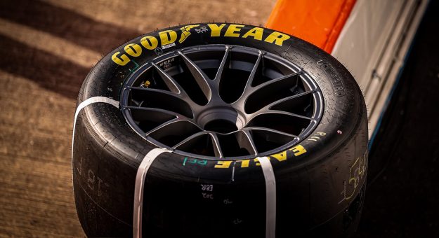 Goodyear tire sits on the wall of a NASCAR race.