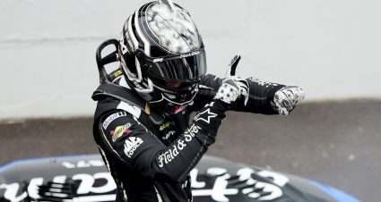 Corey Heim signals his signature 'Heim Time' celebration after winning the Brickyard 400.