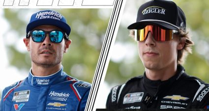 Kyle Larson and Carson Hocevar look on.