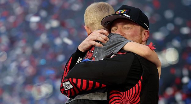 tyler reddick hugs and celebrates with his son
