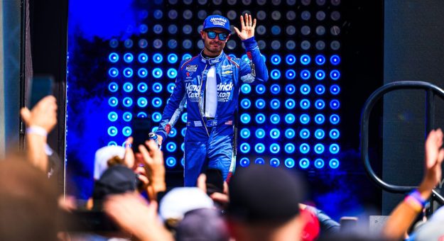 Kyle Larson waves to fans as he emerges for driver intros on Sept. 13, 2026 at World Wide Technology Raceway at Gateway in Madison, Illinois.