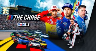 The Cup Series fields barrels toward Turn 1 during last year's playoff race at Kansas Speedway