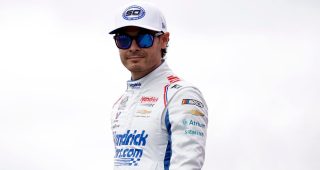 Kyle Larson, driver of the No. 5 HendrickCars.com Chevrolet, walks onstage during driver intros before the NASCAR Cup Series Hollywood Casino 400 at Kansas Speedway on Sept. 27, 2026 in Kansas City, Kansas.