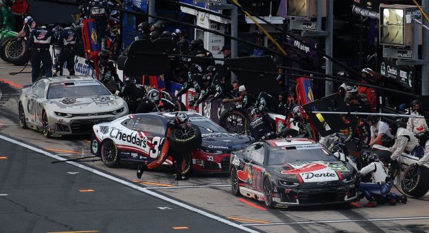 NASCAR Cup Series teams pit at Charlotte.